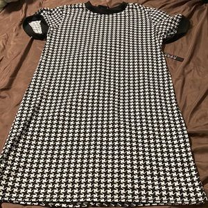 A black and white never worn Poof New York dress